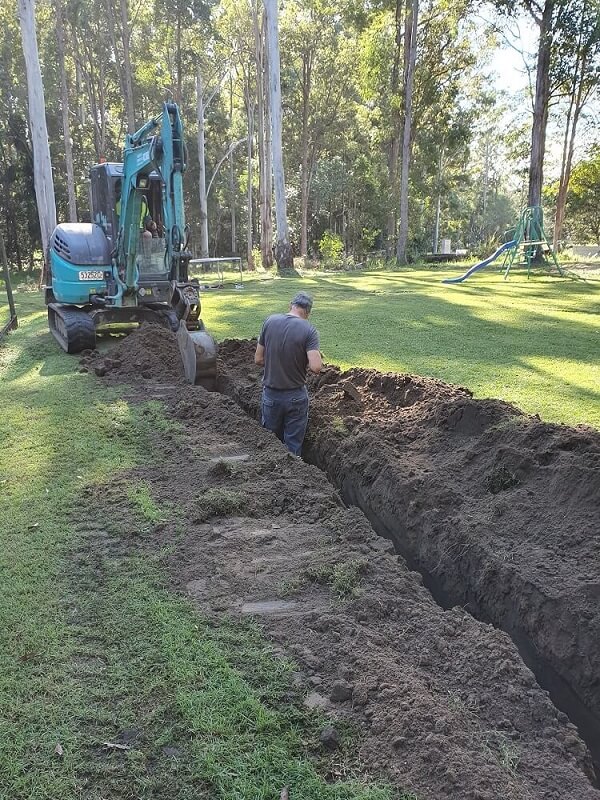 Suncoast Energy technician on the project site for underground power installation